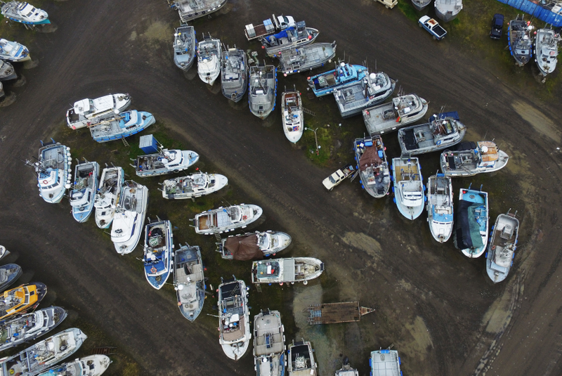 Fishing boats wintering at the PAF Boat Yard in Dillingham, Alaska; the population in the town swells during the summer, as out-of-state fishermen come to Dillingham to work. Photo credit: Duncan Sullivan